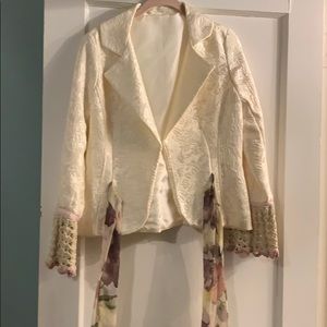 Ivory brocade blazer with knit cuffs and ribbon